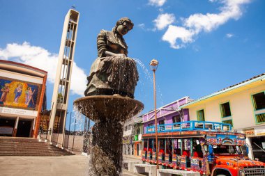 AGUADAS, COLOMBIA - JANUARY 15, 2024: Monument to the traditional Aguadas Hat Weaver at the historical downtown of the heritage town of Aguadas in Colombia. clipart