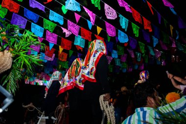 Chapulhuacanito, San Luis Potosi, Mexico - October 31, 2024: Traditional parades at the inauguration of the Xantolo celebration in the small town of Chapulhuacanito, clipart