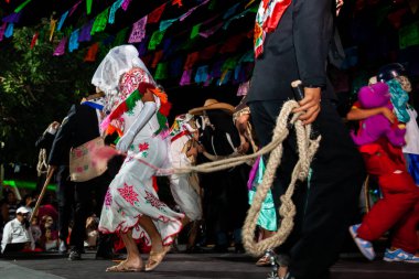 Chapulhuacanito, San Luis Potosi, Mexico - October 31, 2024: Traditional parades at the inauguration of the Xantolo celebration in the small town of Chapulhuacanito, clipart