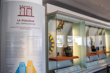 Mexico City, Mexico  November 12, 2024: View of the first room of the Templo Mayor Museum with a sign describing the duality of the temple, dedicated to the gods Tlaloc and Huitzilopochtli. clipart