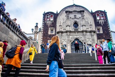 Mexico City, Mexico - October 27, 2024: Female tourist at the Chapel of the Little Hill of the Angels on Tepeyac Hill in Mexico City built in 1740. Chapel of Tepeyac. clipart