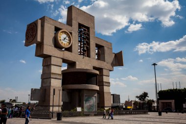 Mexico City, Mexico - September 16, 2024: The Basilica Bell Tower a carillon which has 48 cast bronze bells at  The Atrium of America better known as The Villa of the Basilica of Guadalupe. clipart