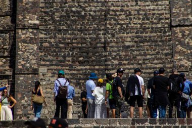 State of Mexico, Mexico - October 24, 2024: Tourists at the Teotihuacan archaeological site in a beautiful blue sky day. Pyramid of the Moon. clipart