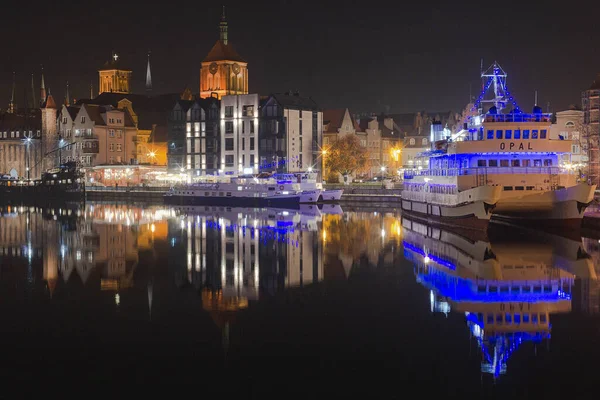 Gdansk, Poland - 1 November, 2022: Cityscape on the Motlawa River in historic city center of Gdansk, Poland. Night, mirror photo of Gdansk