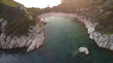 Aerial drone view over a rocky coastline during the sunset in Porto Timoni beach, Corfu Island, Greece