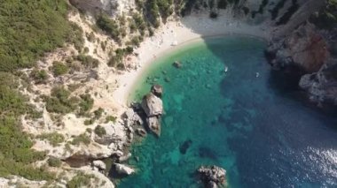 Aerial view of turquoise waters of Yali (Gyali) beach, Corfu Island, Greece