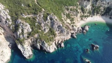 Flying over turquoise waters of Yali (Gyali) beach of Corfu Island, Greece