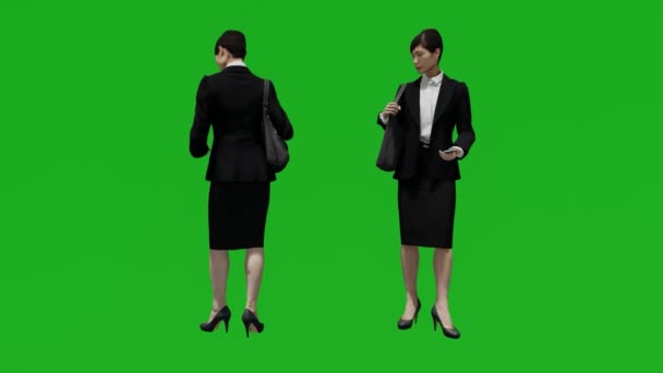 3Dアジアの女性の緑の画面チェック電話で2つの異なるビュー — ストック動画