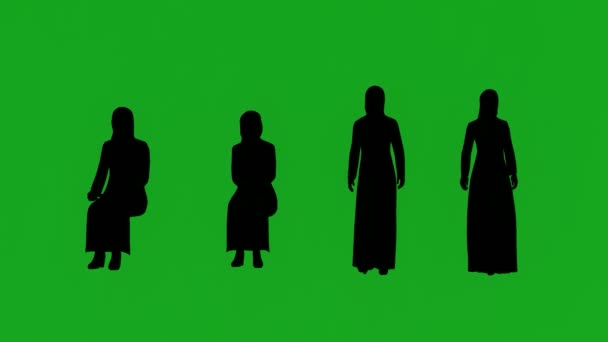 緑のスクリーンで4人のアラブ人女性のシルエットが語り 座っているアニメーション — ストック動画