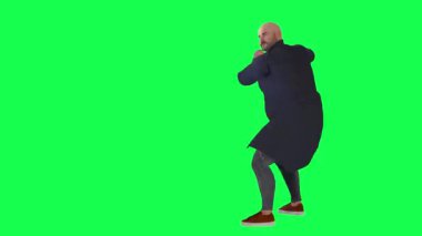 Yeşil ekranda kriket oynayan kel adam.