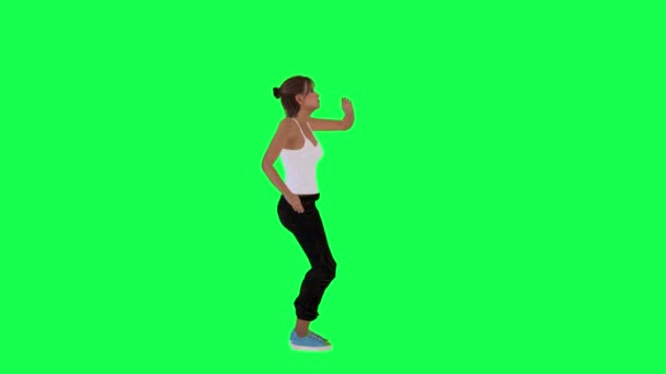 スリム若いです女の子歩くと一緒にダンスから左角度上の緑の画面レンダリングクロマキー人分離 — ストック動画
