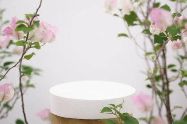 empty white wooden podium pink  flowers decoration on white background with space.beauty cosmetic and romantic valentines or mother,birthday woman love gift product pedestal platform stand display.
