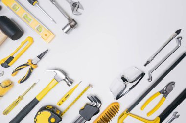 Top view construction tools DIY on white background.concept for repair or build in workshop.