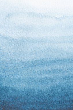 close-up soft stain liquid indigo deep blue water color on paper surface abstract background.concept idea for modern card ,backdrop vintage retro,sea wave design.