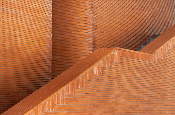 modern architecture building exterior wall panel with orange brown block brick texture pattern.