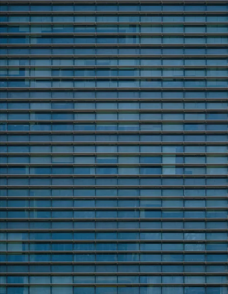 close-up soft light pattern glass wall facade exterior architecture building reflection blue sky clean environment background.modern business office concept,smart city backdrop cover minimal design.