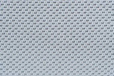 örgü yumuşak lifin makro desenini kapat sentetik kumaş modern mobilya malzemesi gri arka plan örer.