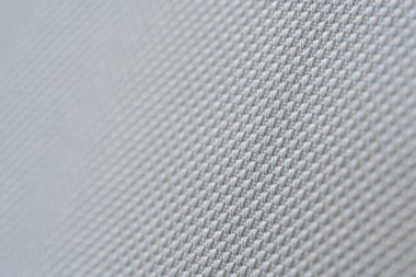 örgü yumuşak lifin makro desenini kapat sentetik kumaş modern mobilya malzemesi gri arka plan örer.