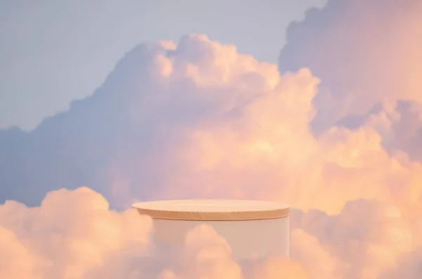 Surreal podium outdoor on blue sky pink gold pastel soft clouds with space.Beauty cosmetic product placement pedestal present stand minimal display,summer paradise dreamy concept.