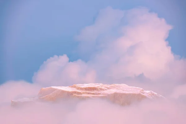 Surreal stone podium outdoors on clouds in soft blue sky pink pastel nature background.Beauty cosmetic product placement pedestal present display,spring summer paradise dreamy concept