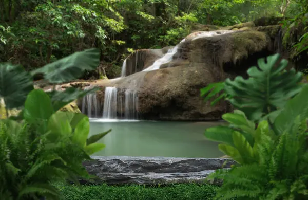 Stone table top podium in outdoor waterfall green tropical forest nature background.Organic natural water product present placement pedestal counter display, spring summer jungle paradise concept.