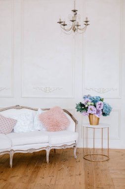 Vintage sofa in a white loft interior