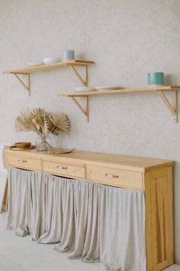 Wooden kitchen close up with cups and bowls