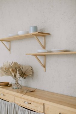 Cups, mugs and bowls in the kitchen loft interior