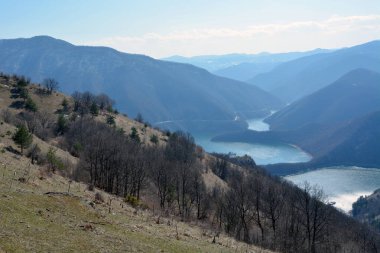 Scenic view of Vacha reservoir in Rhodopes Mountain, Devin Municipality, Bulgaria from Chilingira trail on a sunny day in the early spring. Horizontal image