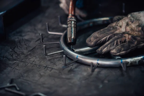 Close up of the steel welding process. Work in the heavy steel industry.