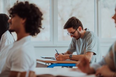 A group of diverse students engages in lively discussion as they educate themselves in a modern classroom, embracing the power of collaboration and knowledge exchange clipart