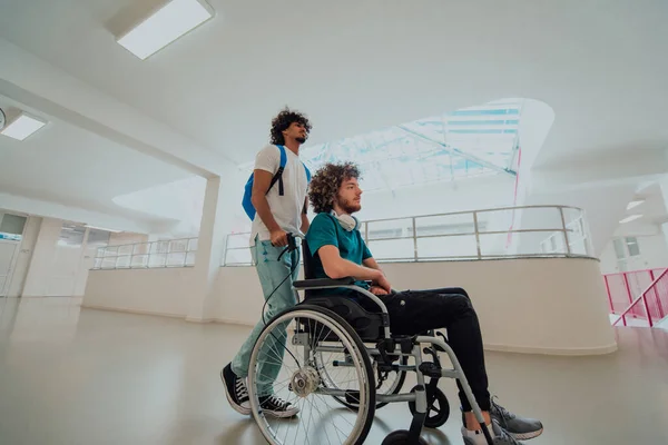 African American student pushing his friends wheelchair through a modern school, demonstrating inclusion, accessibility, and the power of friendship.Assistance to people with disabilities.