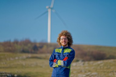 Engineer meticulously supervises the maintenance and operation of electric turbines on-site, ensuring optimal functionality and efficiency. clipart