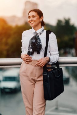 A stylish Latina businesswoman confidently walks the bustling city streets, her briefcase in hand and a determined smile on her face.  clipart