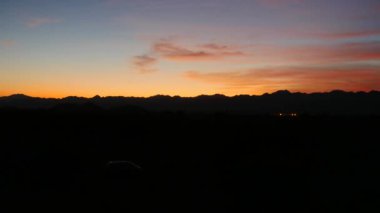 Cinematic time lapse of sunrise in Iran with van. vanlife. High quality 4k footage