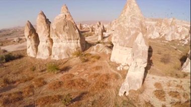 Cinematic aerial top view of rock formations in Cappadocia in Turkey. Near Bird strike. High quality 4k footage