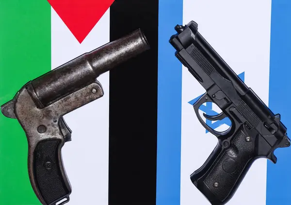 War between Palestine and Israel. The picture with the two flags with two guns that show us that they are at war. Stop war. peace. High quality photo