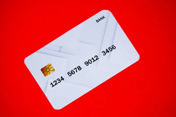 A gray card which is a very rare one pictured on a red background, the card is a pocket where we can keep money online. High quality photo