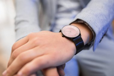 watch on the man's hand at a private event