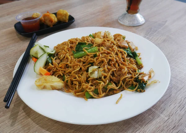 stock image stir-fried noodles with pork and vegetables