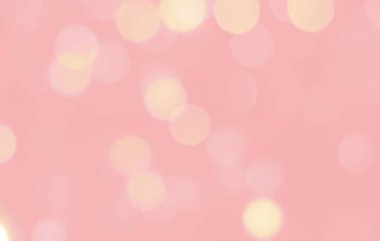 Kopyalama alanı olan pastel renklerle bokeh arkaplanı. Açık pembe arkaplan üzerinde pembe ve sarı daireler olan soyut arkaplan çözünmüş.