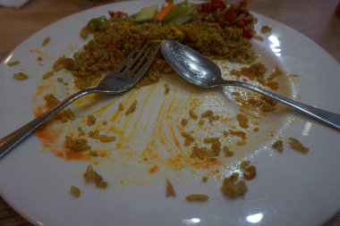 The empty dish after food. Leftover food on plate.