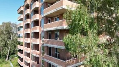 Aerial view facade of a multi-story brick building. House under construction