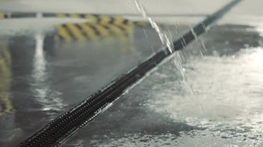Water flows into the sewer in the underground parking lot. Burst of the water supply pipe