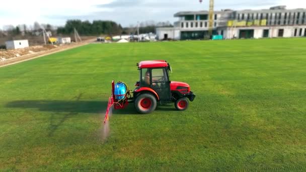 Tractor Sprinkles Grass Football Field Maintenance New Soccer Field Grass — Vídeos de Stock