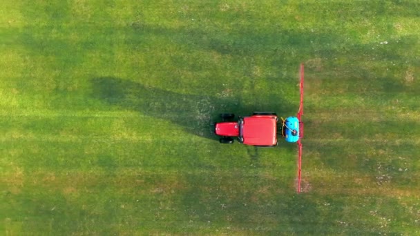 Aerial Top View Tractor Sprinkles Grass Football Field Maintenance New — Wideo stockowe