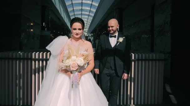 Sophisticated Wedding Duo Atrium Bride Groom Poised Sunlit Atrium Exuding — Stock Video