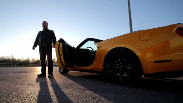 Man Standing Next Yellow Convertible Car Confident Man Standing Next — Stock Video