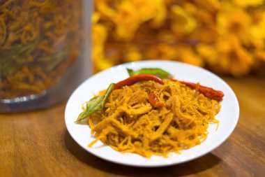 Kho Ga (Spicy Dried Chicken): the Vietnamese snacks made from chicken meat with some chilly, lemon leaf and dried onion