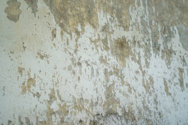 Texture of old gray concrete wall for background. Rough texture on gray wall rough form due to peeling paint layer due to rain